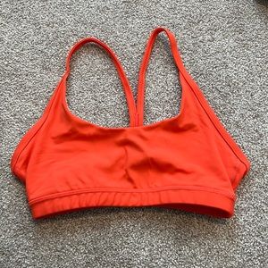 Fleo Cami sports bra. Bright coral color.